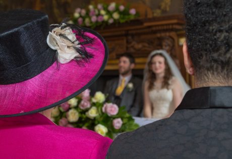 wedding couple sitting at alter
