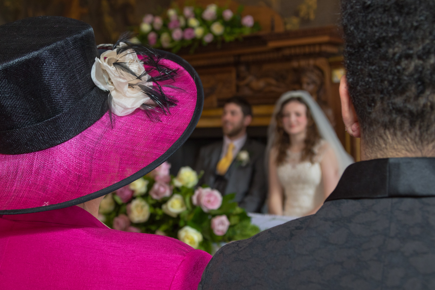 wedding couple sitting at alter