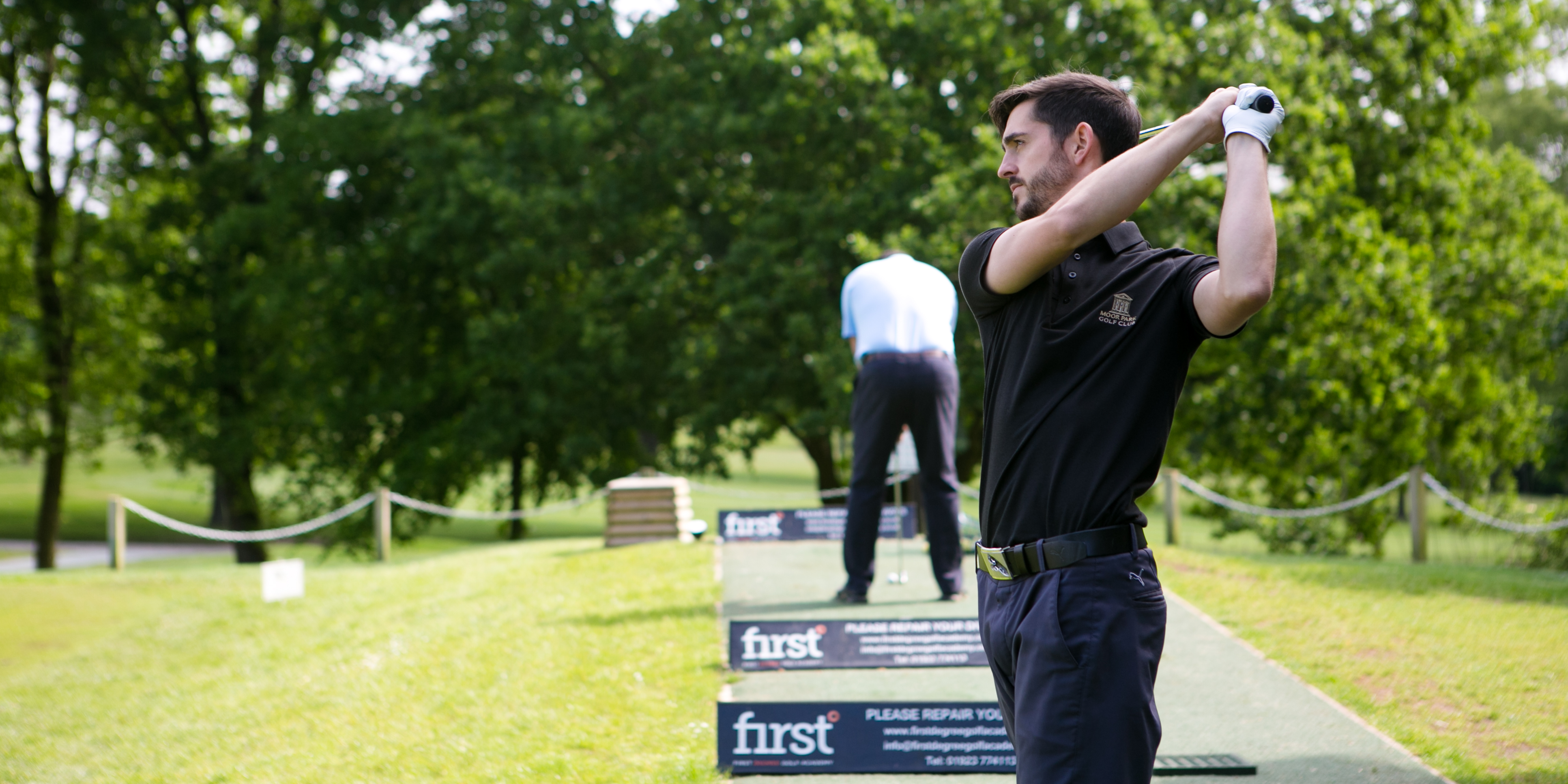 Practice shots on driving range