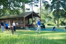 Male teeing off 16th with HWH