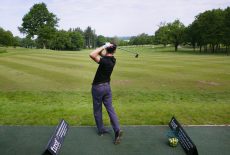 Golfer on driving range